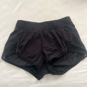 Black Lululemon size 2, 2.5 inch shorts.